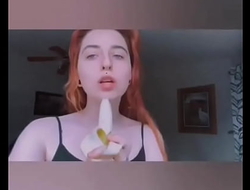 Girl sucking banana